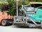 Cairo, Egypt, April 8 2023: Asphalt paver trucks and compactors, A paver (road paver finisher, asphalt finisher, road paving