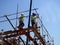 Cairo, Egypt, May 10 2023: engineers and workers at a construction site with scaffolds and mobile cranes in one of the new