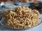 Cake anthill or chuck-chuck with honey filling, on the background of a table with another meal