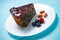 Cake with berry fruits, chia cereals and nuts isolated over wooden background