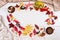 Cake, black chokeberry, red Rowan, autumn leaves and a Cup of coffee with milk on a light background. Dishes of clay. Beige Jersey