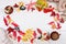 Cake, black chokeberry, red Rowan, autumn leaves and a Cup of coffee with milk on a light background. Dishes of clay. Beige Jersey