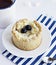 Cake with blueberry, tea cup, marshmallows and blue striped paper bag