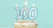 Cake with burning candles as number one hundred