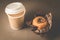 Cake with a chocolate stuffing and cappuccino plastic cup/cake with a chocolate stuffing and cappuccino plastic cup on a dark