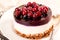 Cake with cranberry jelly cream round shape berries closeup