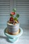 Cake decorated with lively flowers of gerbera and fresh figs.