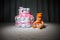 Cake of diapers, baby shower gift diaper, wrapped diapers, a roll of diapers, wrapped a clean diaper on table with baby doll decor