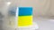 Cake in the form of Ukrainian flag spikelet of wheat delicious filling fruit dessert turn cake on plate cut piece