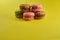 Cake macaron on yellow background flavor almond cookies pastel colors