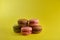 Cake macaron on yellow background flavor almond cookies pastel colors