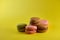 Cake macaron on yellow background flavor almond cookies pastel colors