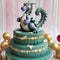 Cake made of mastic in the form of a green dragon. Sweet food decoration for a feast for the holiday