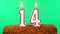 Cake with the number 14 lighted candle. Chroma key. Green Screen. Isolated