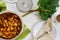 Cake or pie, rhubarb leaf, coffee cup, sieve with icing sugar an