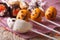 Cake pops pumpkins and spooky for Halloween. horizontal