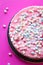 Cake with Small Marshmallows for Birthday Party on Pink Background