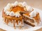 Cake with sponge cakes, whipped cream, caramel and peanuts