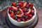 Cake with strawberry topping, blackberries with
