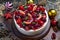 Cake with strawberry topping, blackberries with