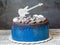 Cake with sweets, cookies, blueberries and guitar topper