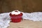 Cakecup red fruit cake with whipped cream with party candy