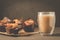 Cakes with a chocolate stuffing and cappuccino glass/cakes with a chocolate stuffing and cappuccino glass. Selective focus