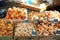 Cakes and pastries for sale on a market counter.