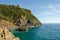 Cala Del Leone, Castel Sonnino Italy. Coast castle on the rock with the sea.