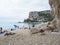 Cala Gonone, Sardinia, Italy, September 8, 2020: Cala Luna beach with sunbathing people and tourist. White sand beach