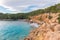 Cala Salada and Saladeta in san Antonio Abad at Balearic Islands Spain. Typical house for fishing boats and rocks.