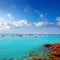 Cala saona in summer with many boats anchored