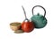 Calabash, bombilla, teapot and bowl of mate tea on white background