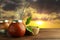 Calabashes with mate tea and bombilla on wooden table outdoors at sunset. Space for text