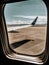 Calafate, Argentina. January 16 2019. Aerial wing airplane. Views through the window of an airplane. Empty runway ready to travel