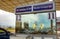 Calais, France - August 12 2018: Cars reflected in the window of a UK Border Control checkpoint, as they approach the Eurotunnel t