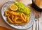 Calamari  in a batter of tempera flour and fresh salad with lemon