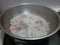 Calamari sizzling in a pan