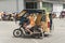 Calbayog, Samar, Philippines. A tricycle driver transports a passenger through streets of downtown Calbayog