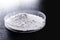 Calcium carbonate  the result of the reaction of calcium oxide with carbon dioxide. Being prepared in petri dish