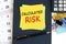 calculated risk - text on yellow paper on blue background, concept