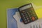 Calculator budget cost and analysis financial and paperwork. Business and finance concept of office desk