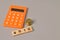 Calculator, coins and wooden blocks with text 401K