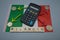 A calculator with colored arrows and some coins on top of an Italian flag with written, rilancio,which means in English, relaunch