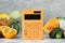 Calculator and food products on white marble table. Weight loss concept