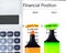 Calculator, highlighter markers on financial statements.