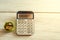 Calculator with money and pennies on a wooden green background. Business concept