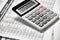 Calculator and reports closeup. Office supplies for working and calculating finance. Business financial accounting concept