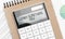 Calculator with text learn something new with craft colored notepad pen and financial documents