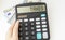 Calculator with text Taxes . Calculator, currency